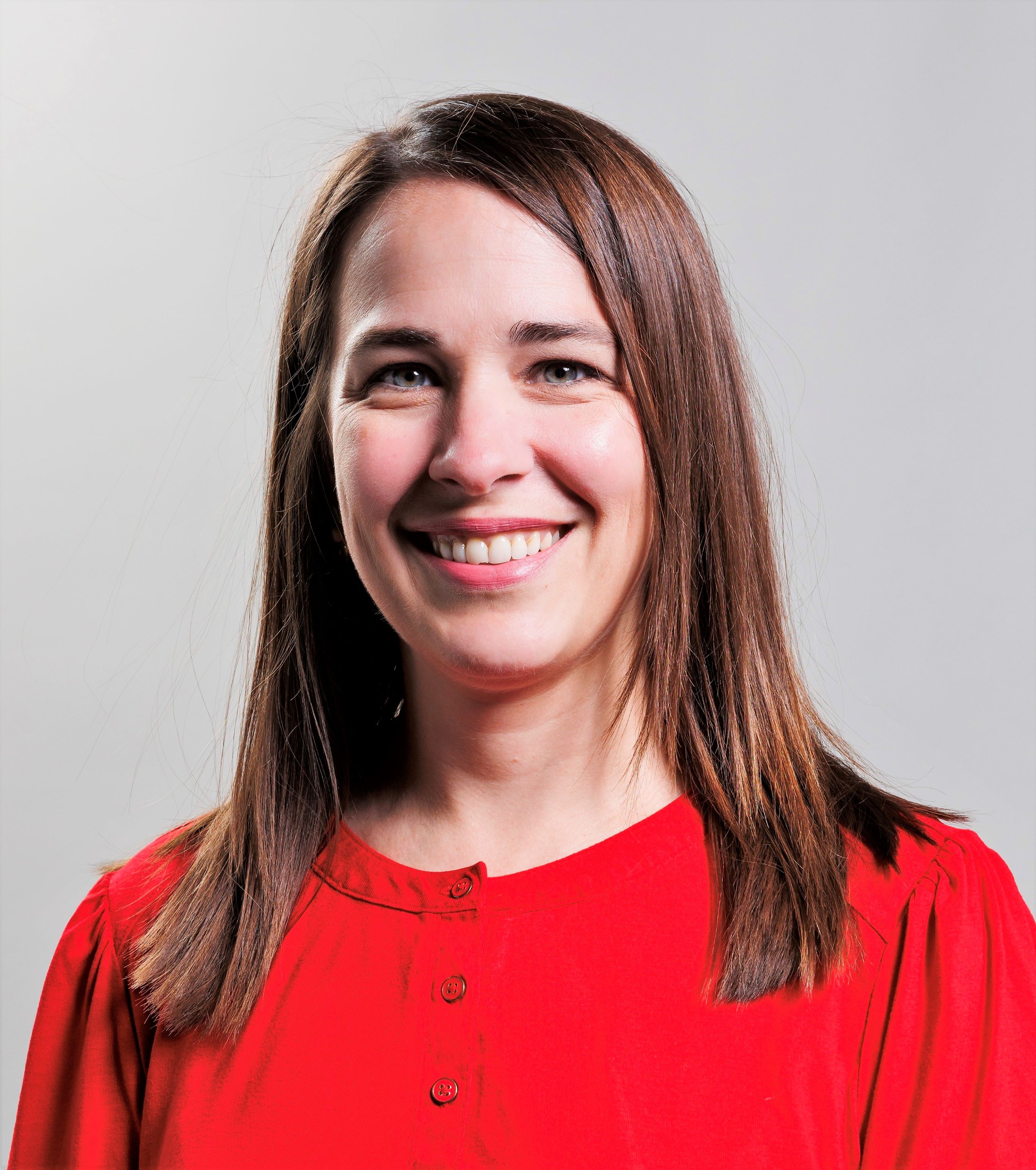 Photo of Leigh Smith-Vaniz, female in red shirt