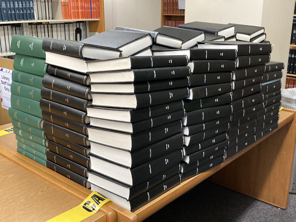Picture of journals stacked on a table