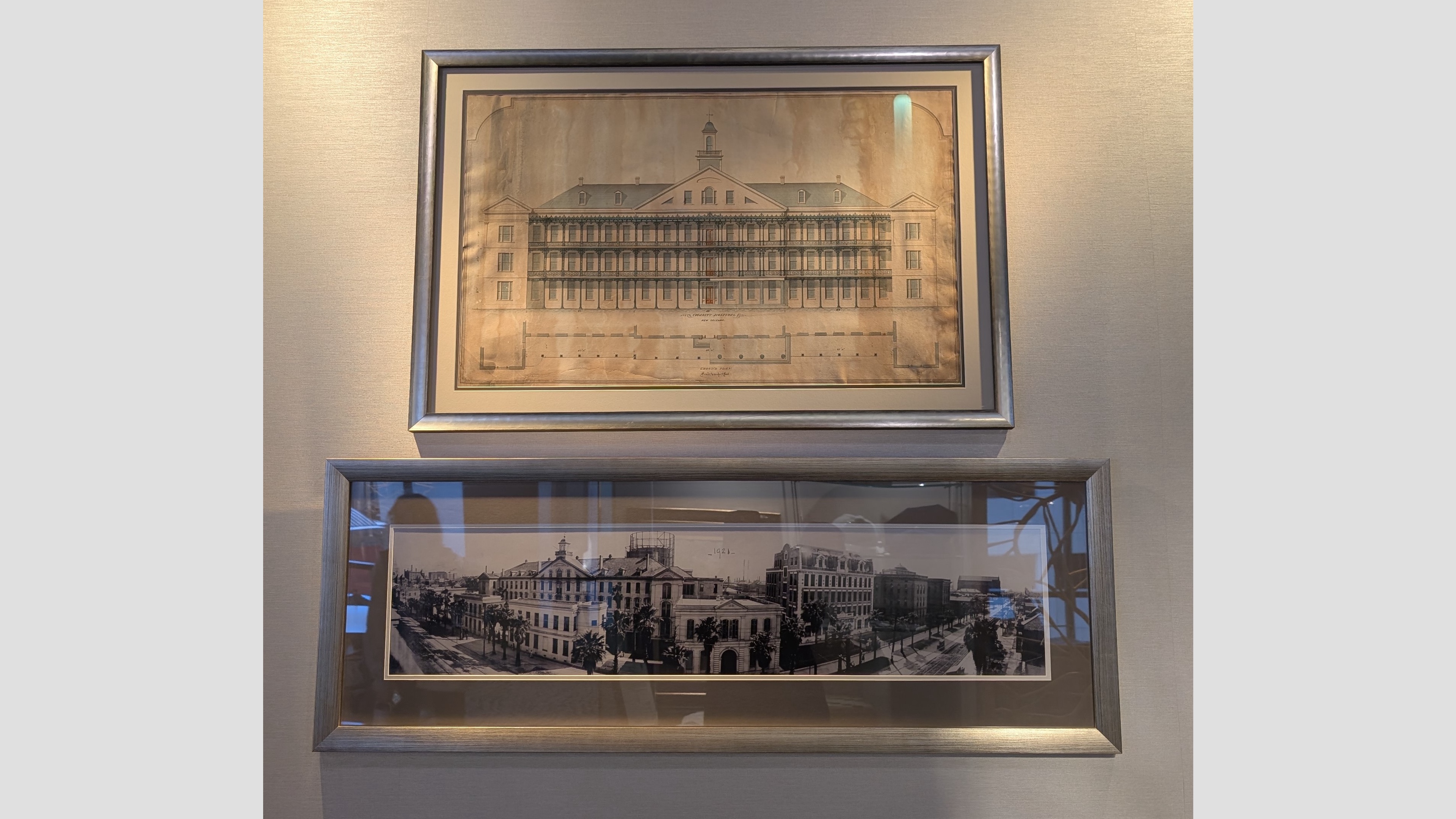 Photograph of two framed pictures of old Charity Hospital