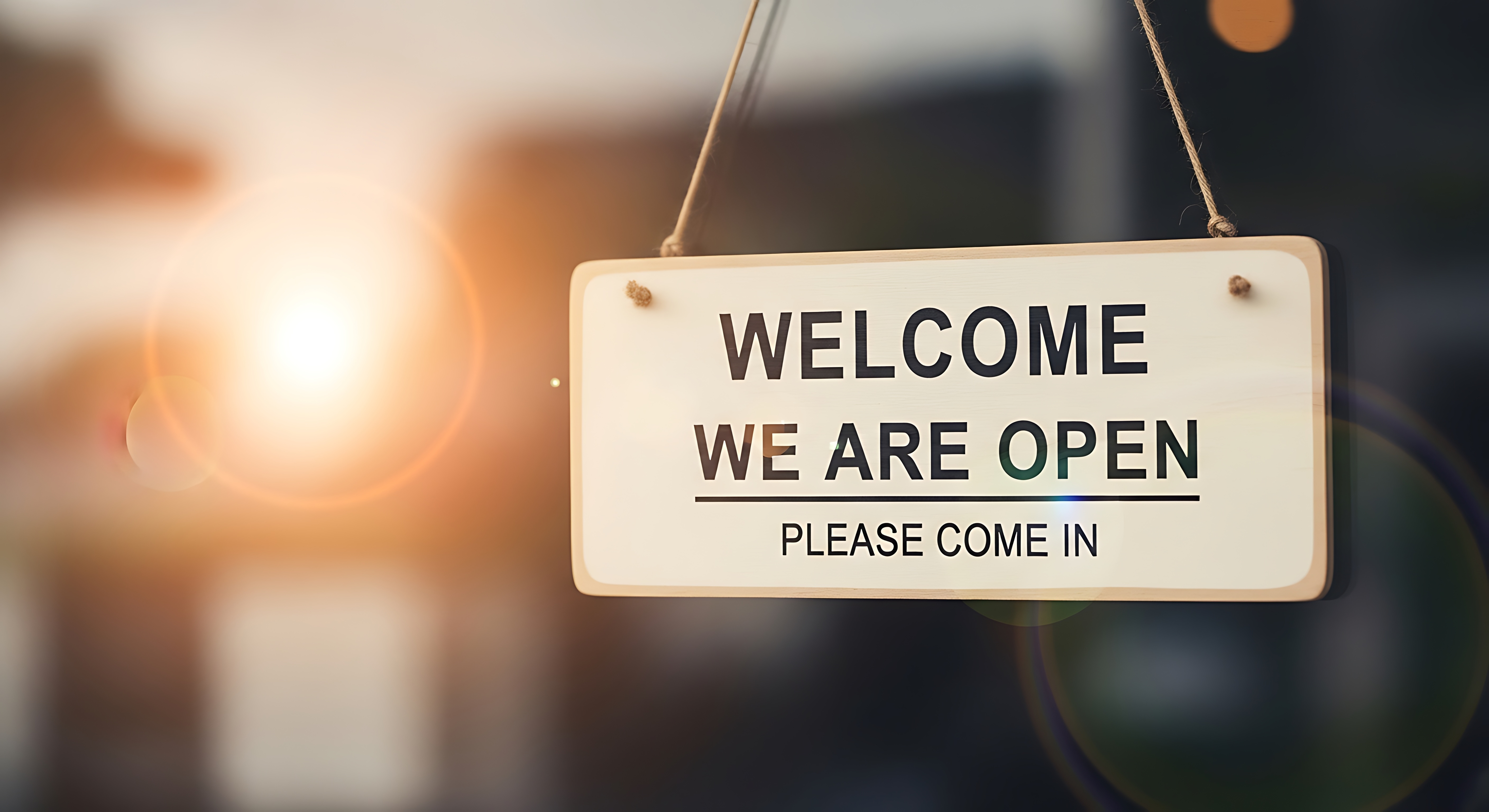 Welcome sign hanging with text we are open for business hours By AK_KADER